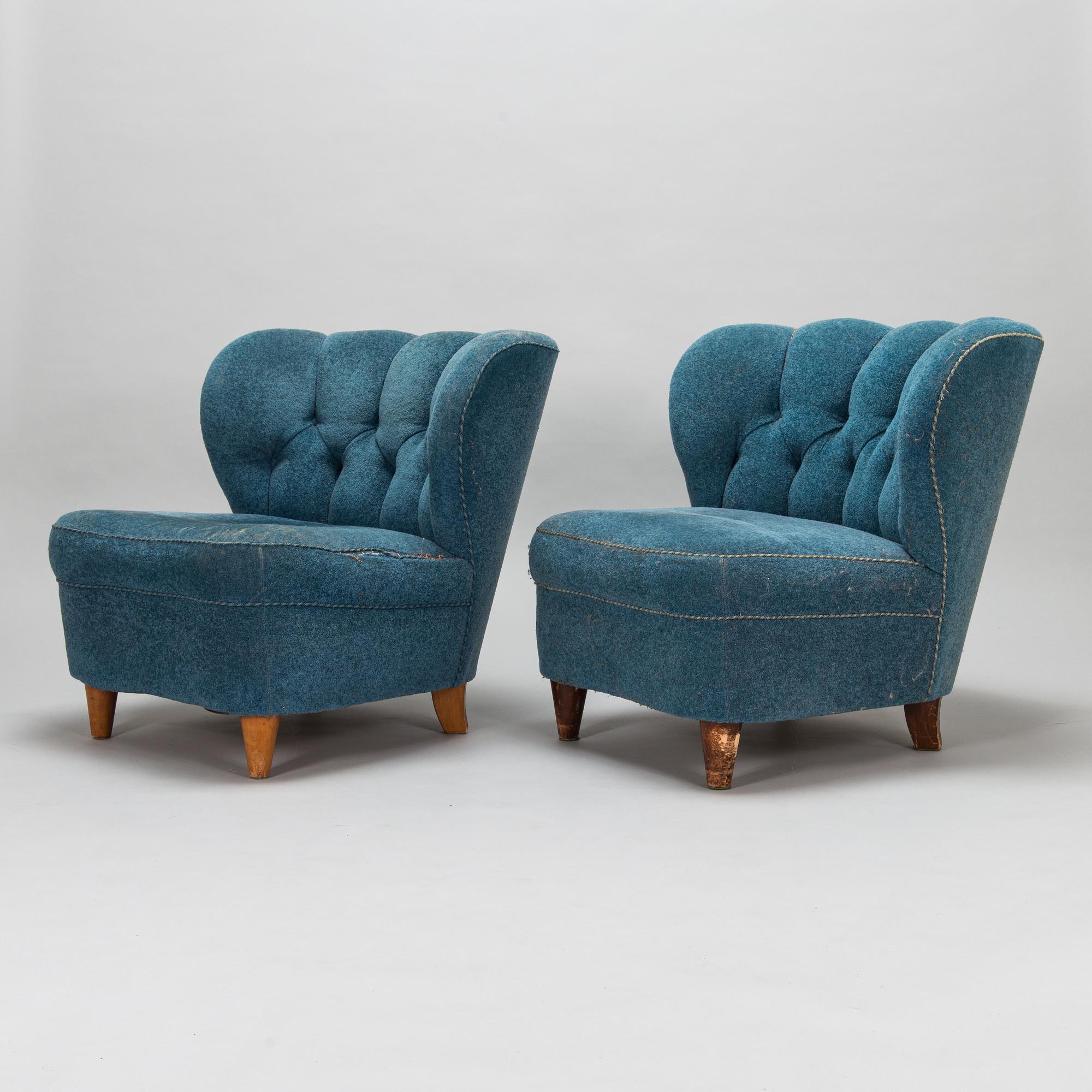 A pair of mid-20th-century armchairs.