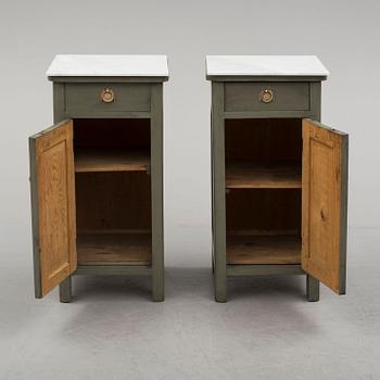 a pair of early 20th century painted bedside tables.