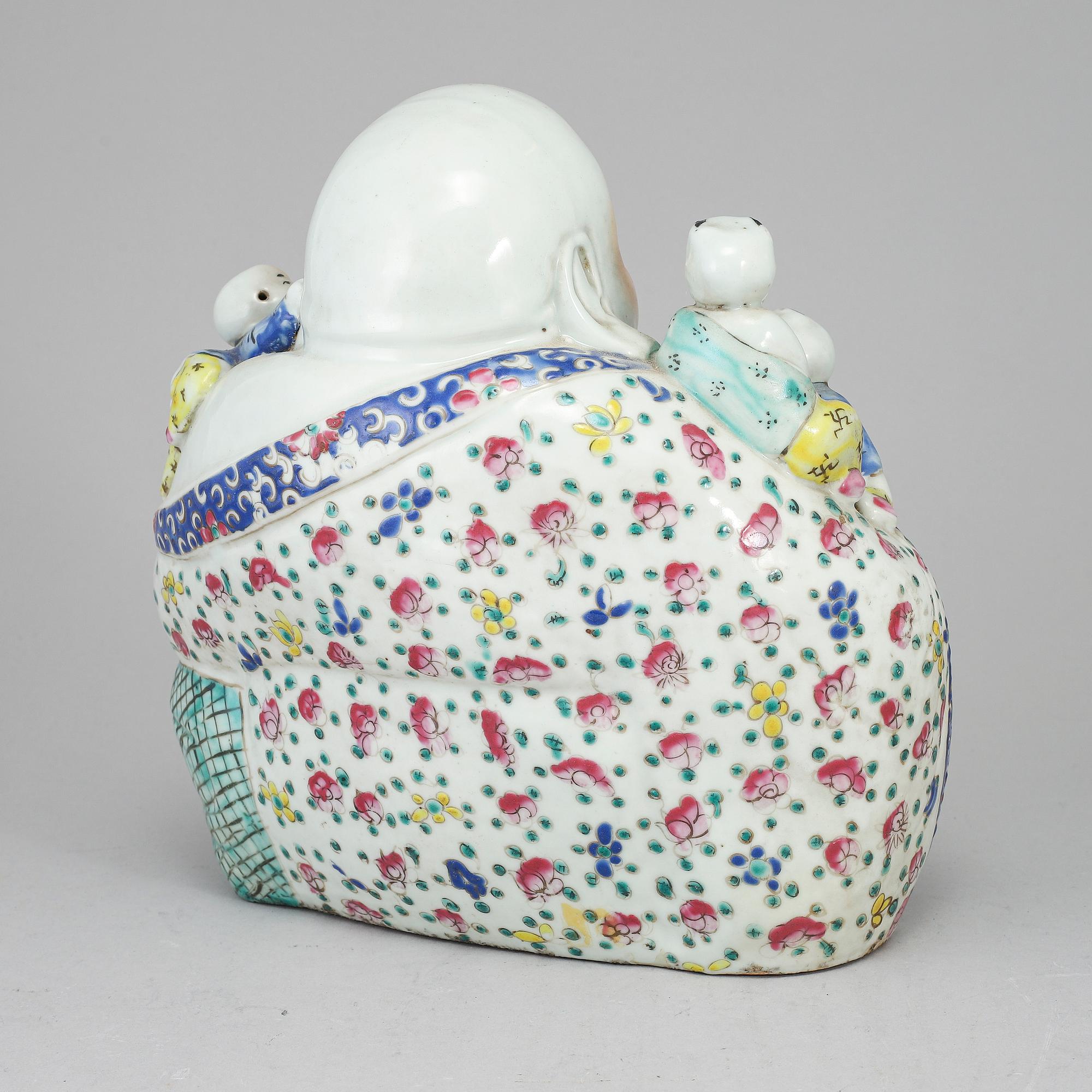 A large famille rose porcelain figure of a buddha with children, 20th century.