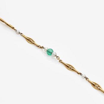A 17K gold necklace with emeralds and cultured pearls.