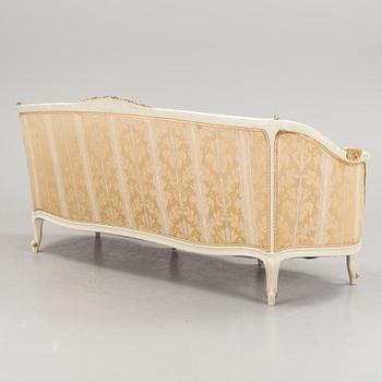 a 1930s rococo style sofa.