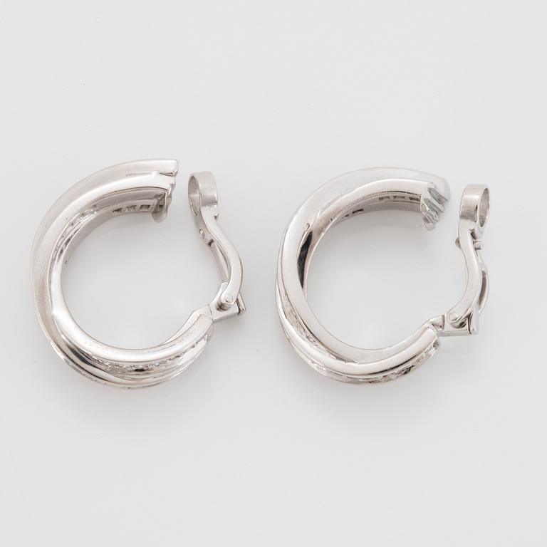 A pair of Cartier "Trinity" earrings in 18K white gold set with round brilliant-cut diamonds.