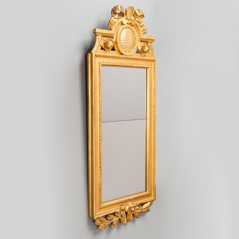 A Gustavian mirror signed Johan Åkerblad (master in Stockholm 1758 - 1799), dated 1785.