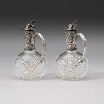 A pair of Russian 20th century parcel-gilt and glass flcongs, possibly of Ivan Katorsky, St. Petersburg 1899-1908.