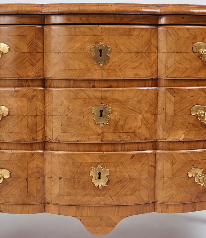 A late Baroque walnut-veneered chest of drawers attributed to J. H. Fürloh (master in Stockholm 1724-1745).