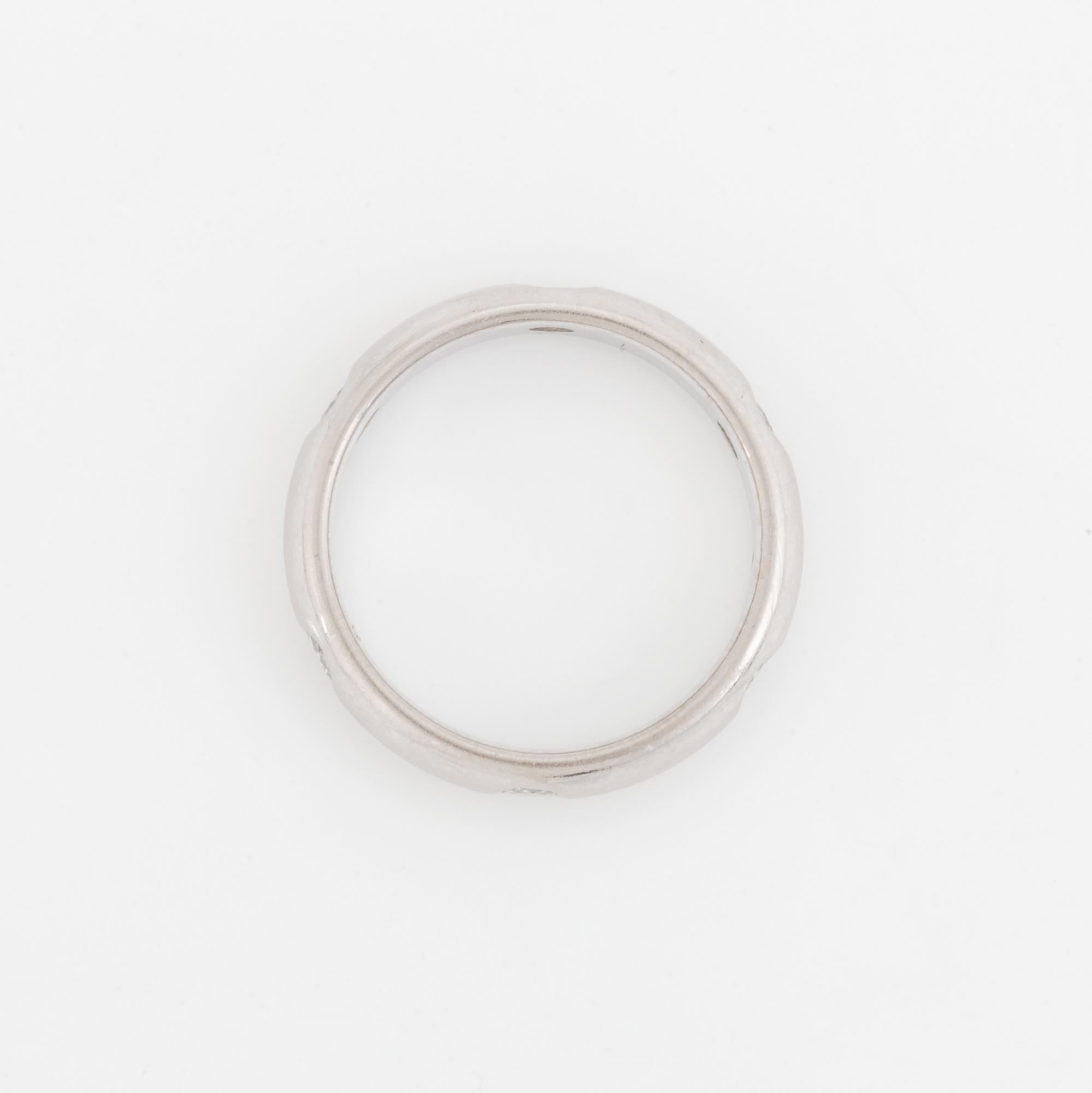 An 18K white gold Cartier ring set with round brilliant-cut diamonds.