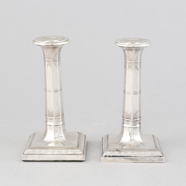 A pair of silver candlesticks, mark of Thomas Bradbury & Sons Ltd, Sheffield 1918.