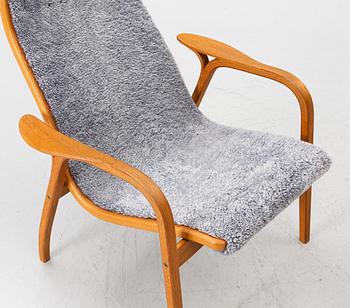 Yngve Ekström, a 'Lamino' armchair with footstool, Swedese, 2004.