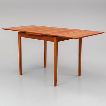 A 1950/60s teak veneered table.