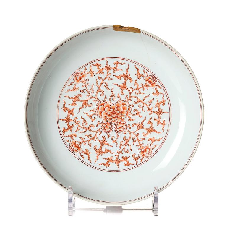 An iron red decorated 'lotus' dish, Qing dynasty, with a Kangxi six character mark and of the period (1662-1722).