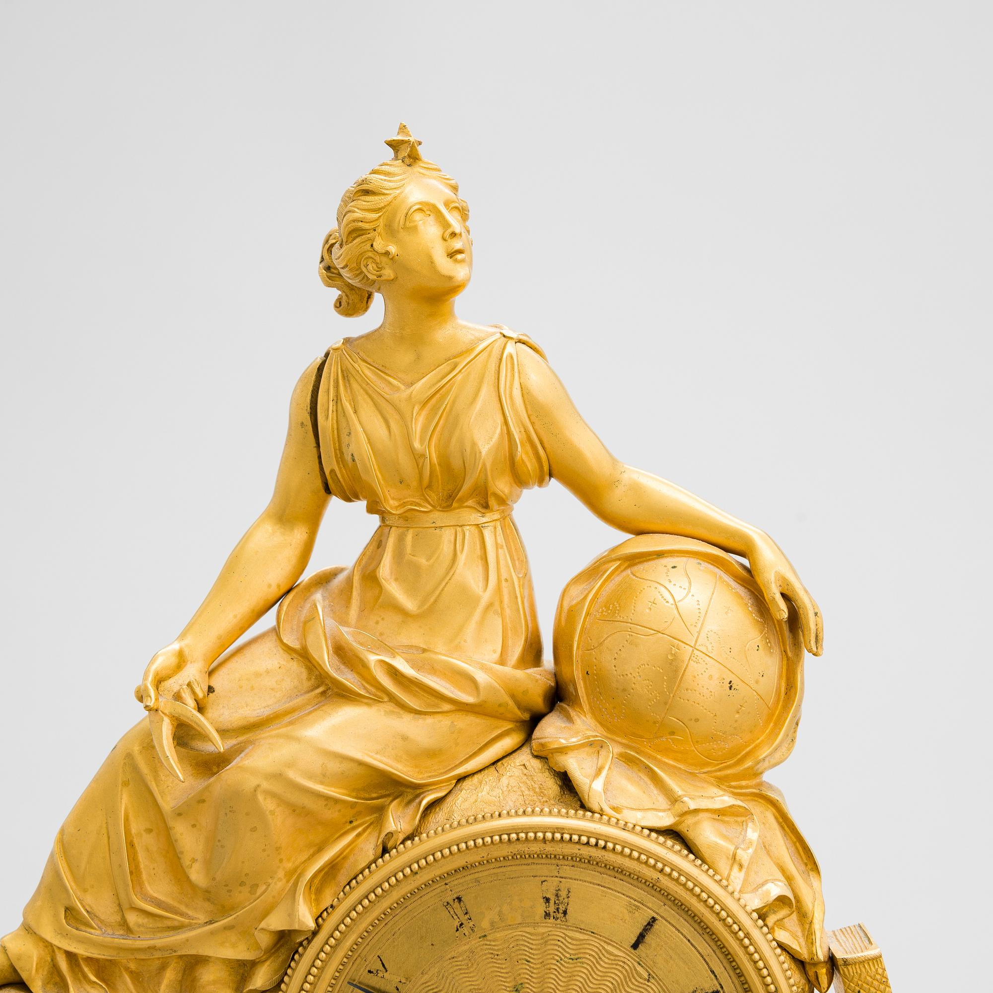 A French Empire mantel clock from 1820s-30s.