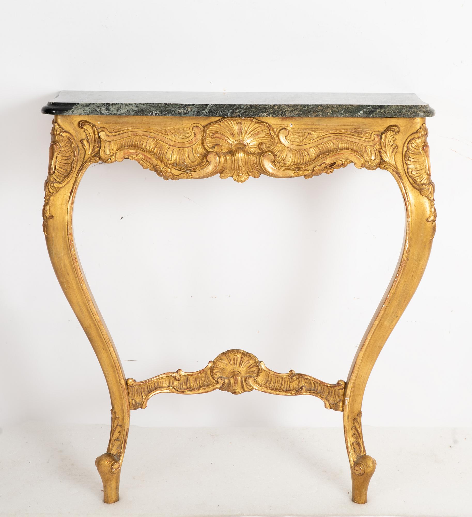 A Rococo style mirror and a console table, first half of the 20th Century.