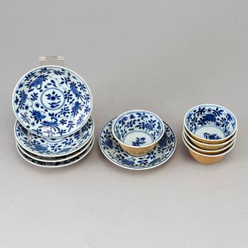 Five blue and white and cafe au lait glazed cups with dishes, Qing dynasty, Qianlong (1736-95).