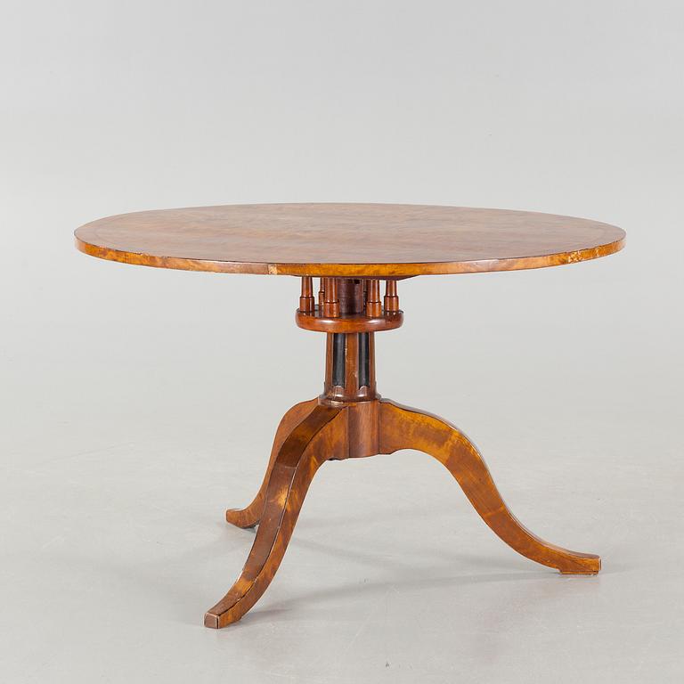 A 19th century drop-leaf table.