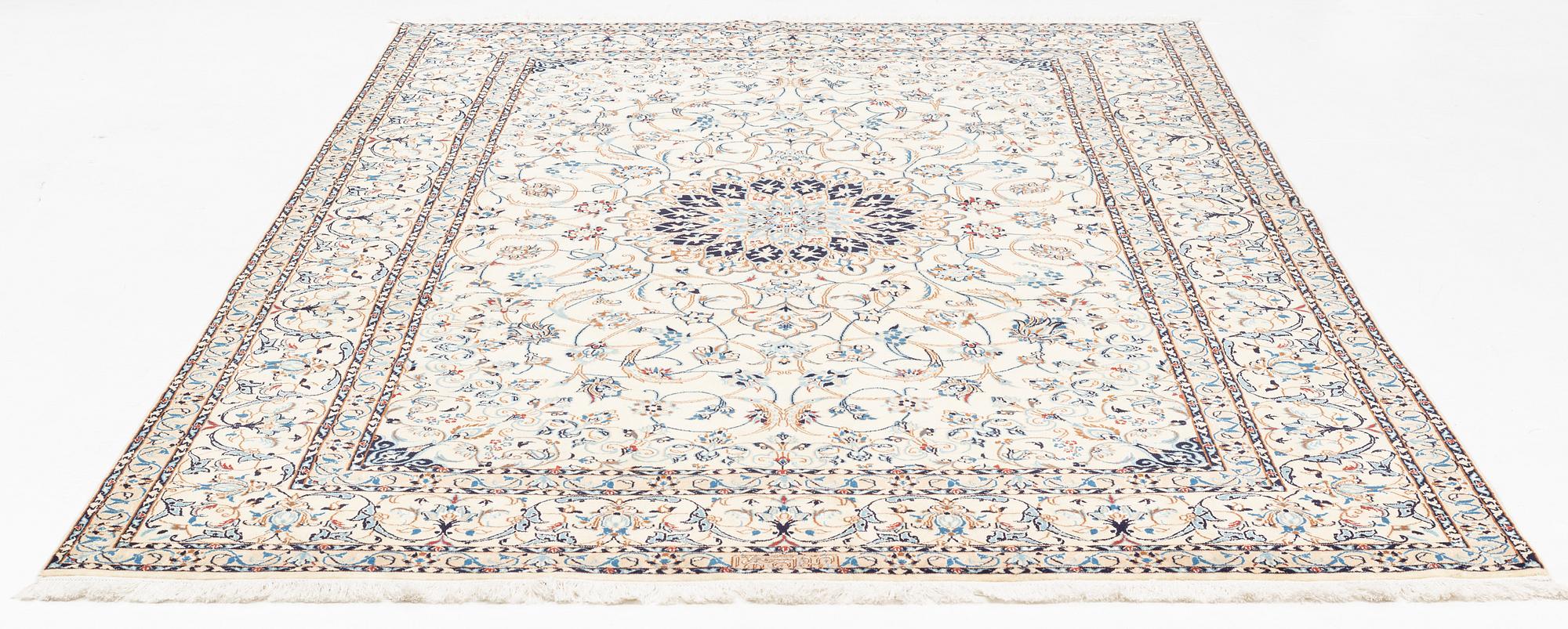 A carpet, Nain, part silk, fine 9 laa, signed, ca 327 x 210 cm.