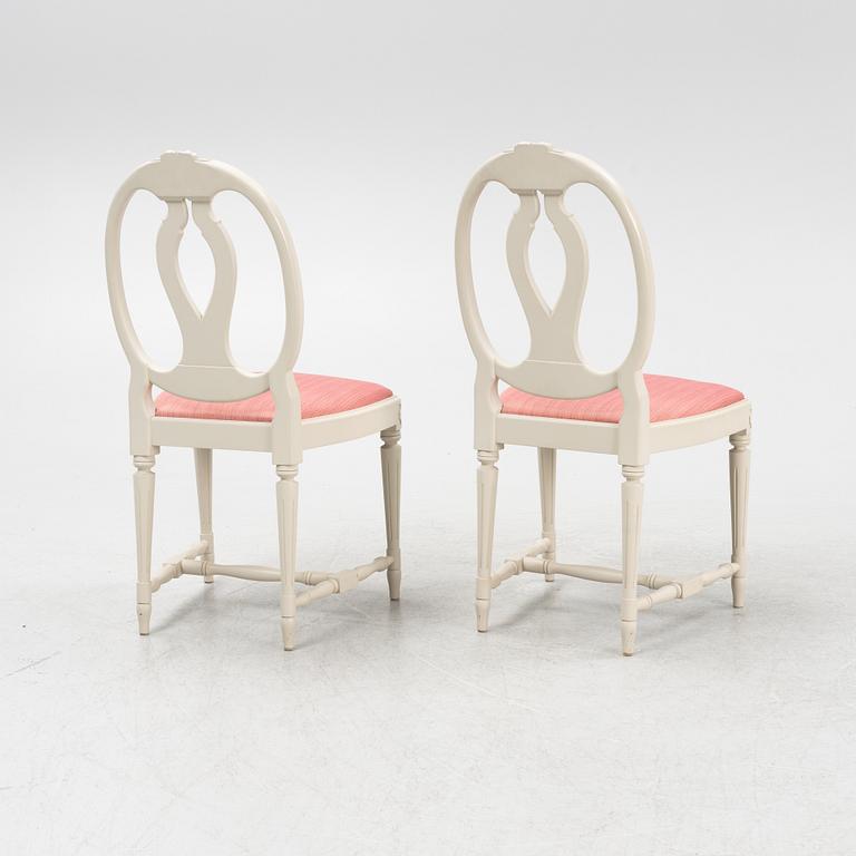 A Gustavian style table with four chairs, second half of the 20th century.