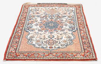 A semi-antique Isfahan rug, central Iran, part silk, signed (Mohammed) Seirafian, c. 120 x 70 cm.