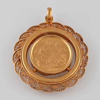 GULDMYNT, half souvereign, infattat i 18K guld. Vikt 18,4 gram.
