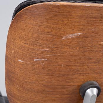 An easy chair and ottoman by Charles & Ray Eames, Herman Miller, USA, produced with licence by Hille, London.