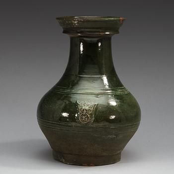 A green glazed jar, Han dynasty (206 BC - 220 AD).