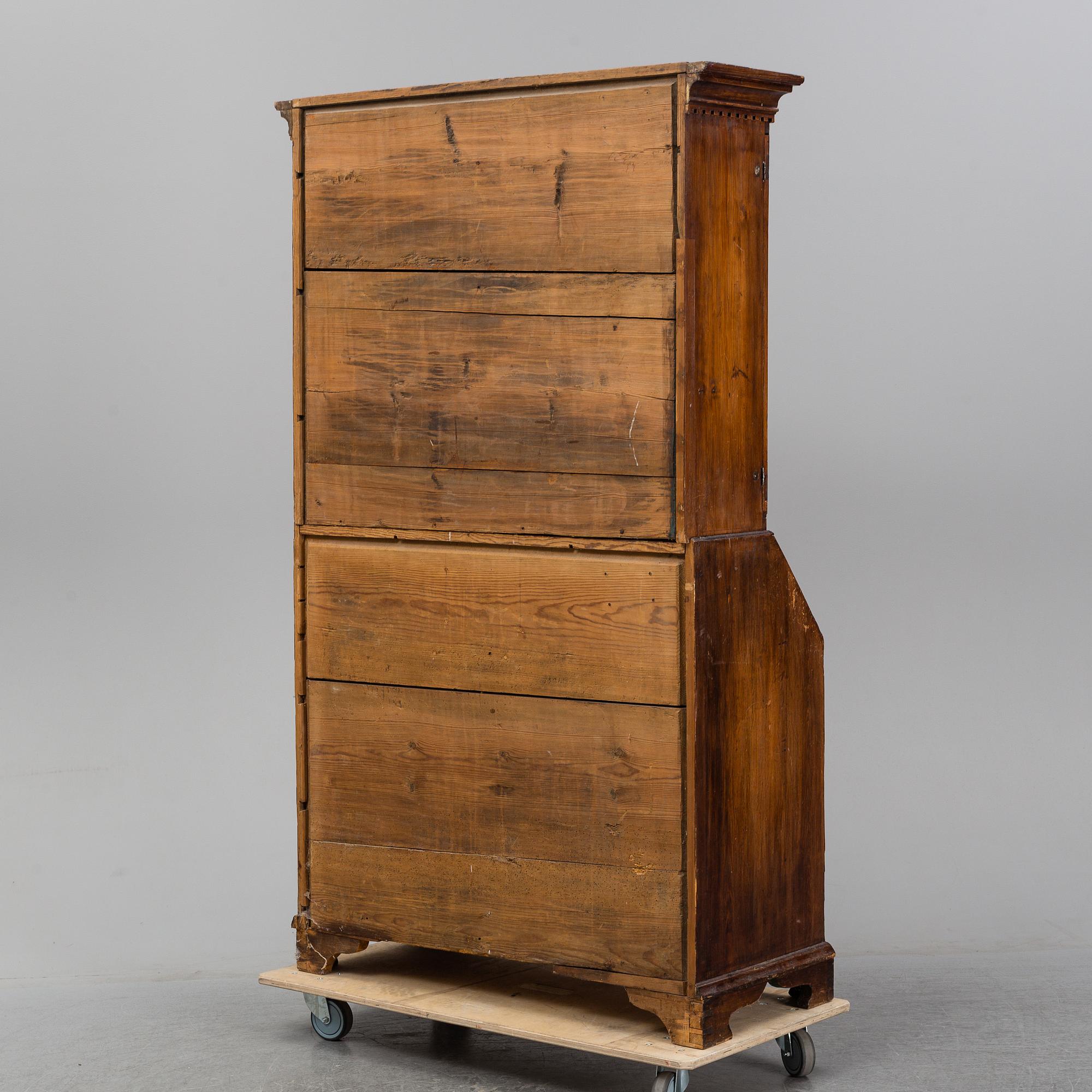 An early 19th Century pine cabinet.