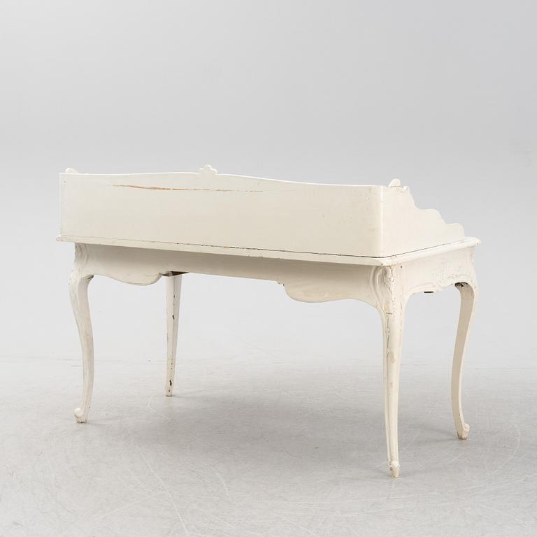 A painted rococo writing desk, mid 18th Century with later parts.