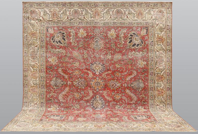 An oriental 'vintage' carpet, c 320 x 295 cm.