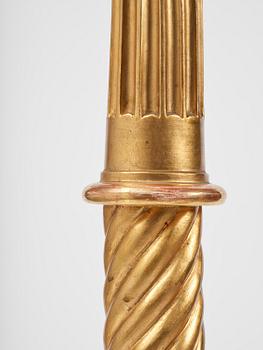 A pair of late Gustavian giltwood torchères by J. Frisk (master in Stockholm 1805-24).