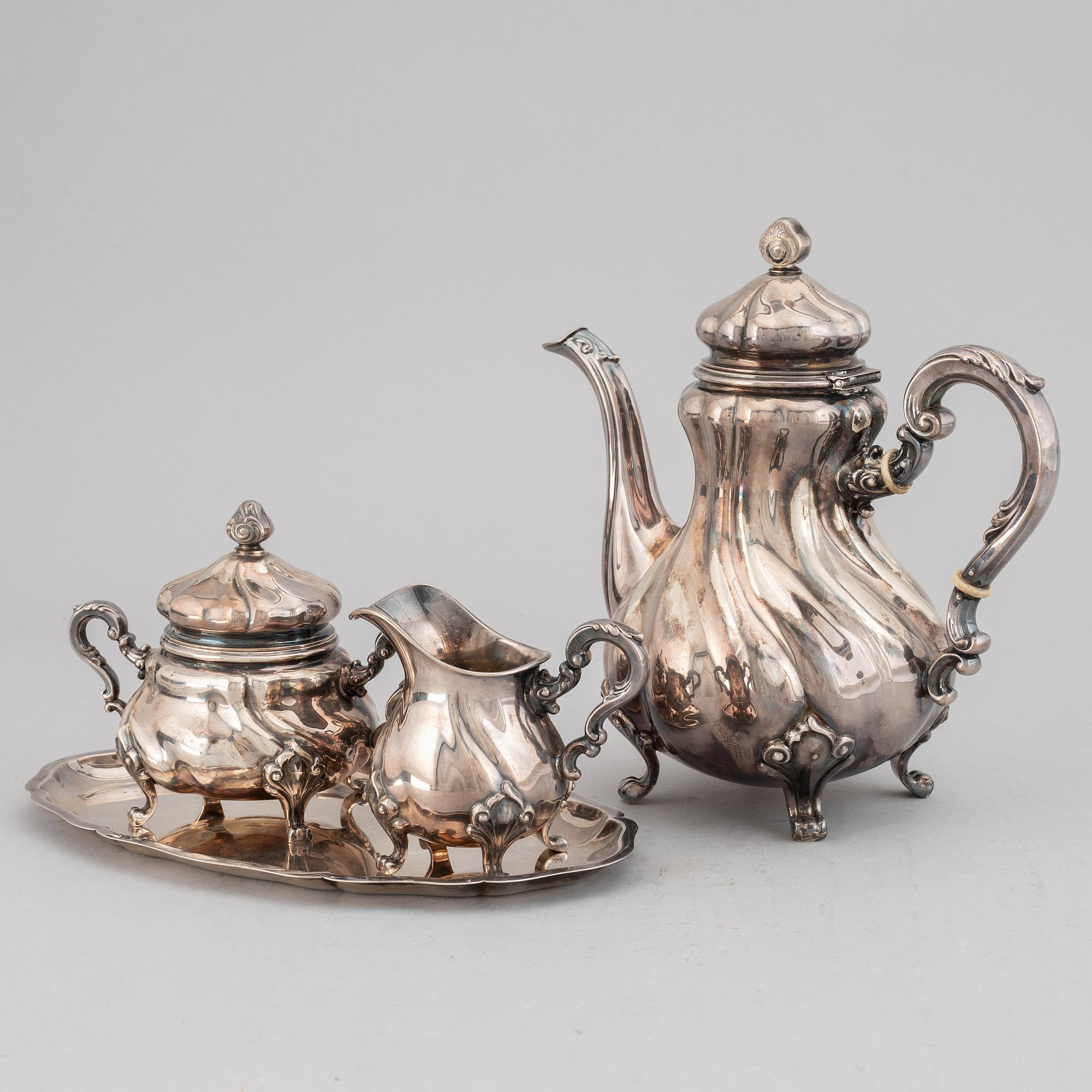 A silver coffee pot, creamer, sugar bowl and tray, swedish import mark.