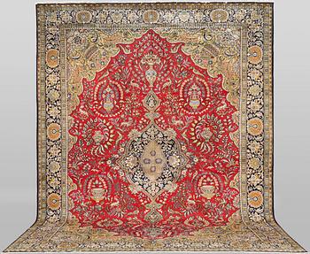 A Ghom carpet, c. 490 x 315 cm.