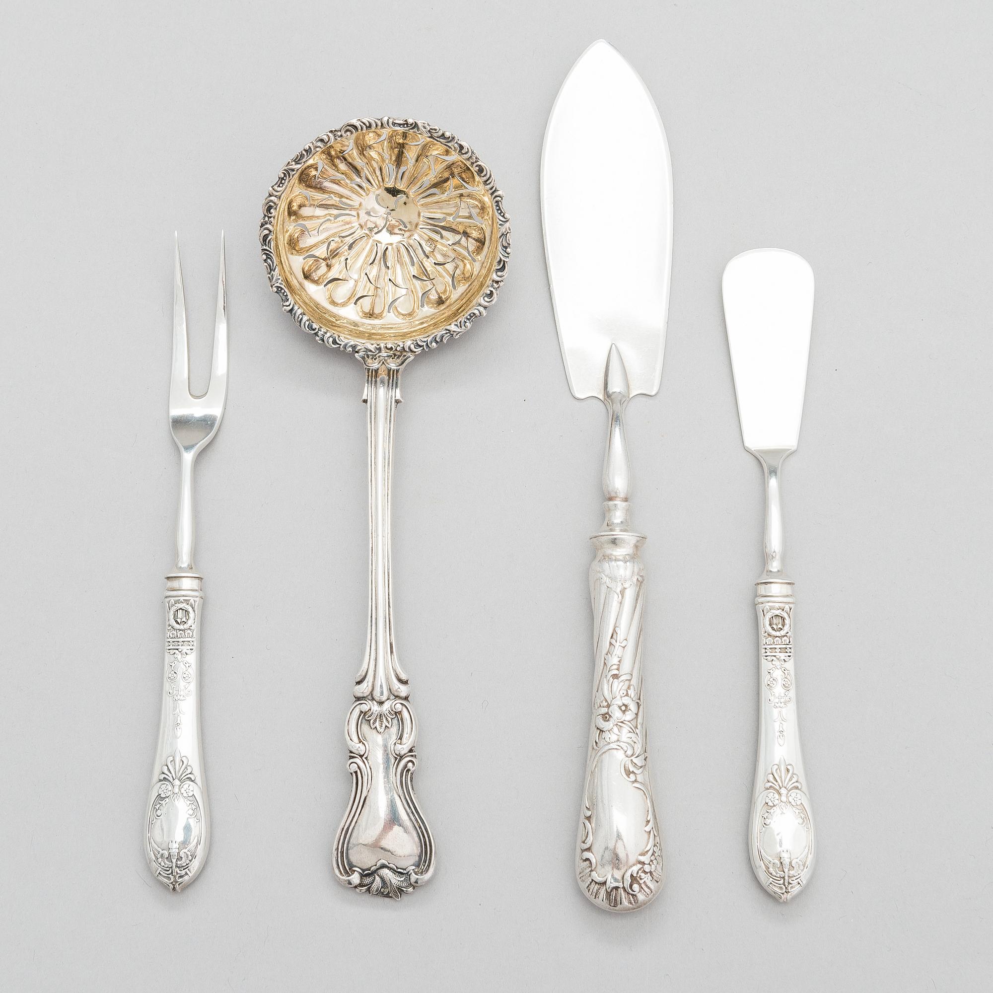 Four pieces of Russian silver cutlery.