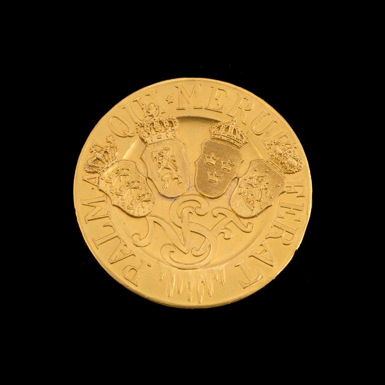 A 23 k gold medal "PALMAM
QUI MERUIT FERAT". Weight ca 21 grams.