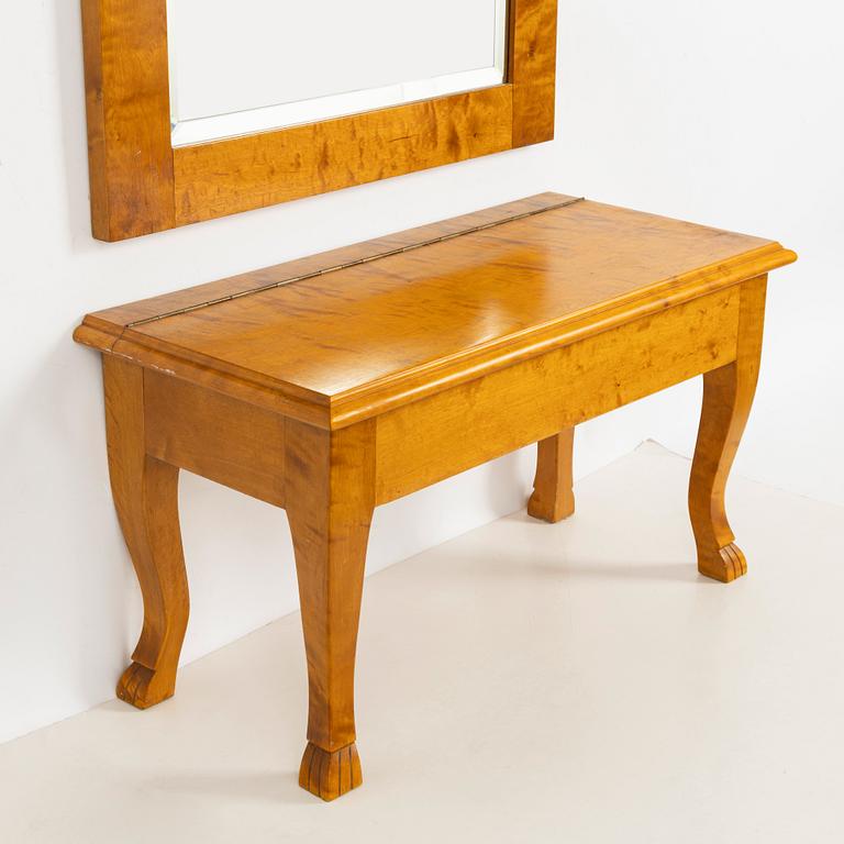 A mirror with console table, early 20th century.