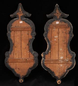 A pair of Swedish Rococo 18th century one-light girandole mirrors.