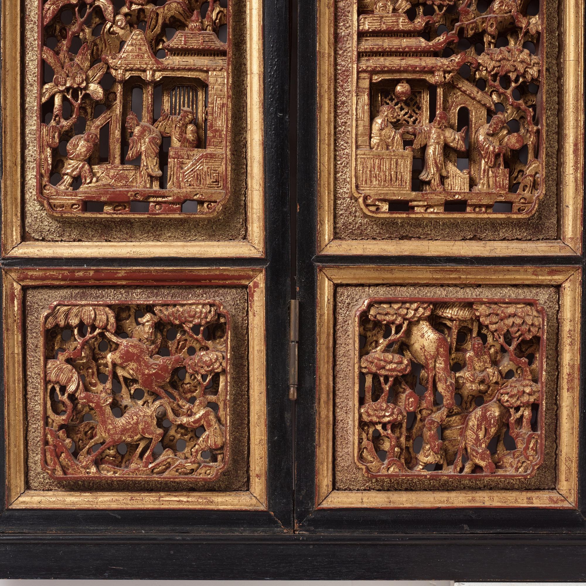 A set of four framed wooden panels, Qing dynasty, 19th Century.