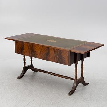 A mahogany veneer desk with desk chair, 20th Century.