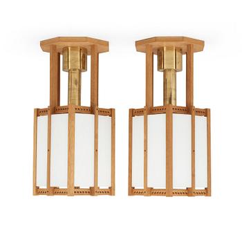 555. A pair of John Kandell oak, brass and opaque glass celing lamps, Sweden 1950's.