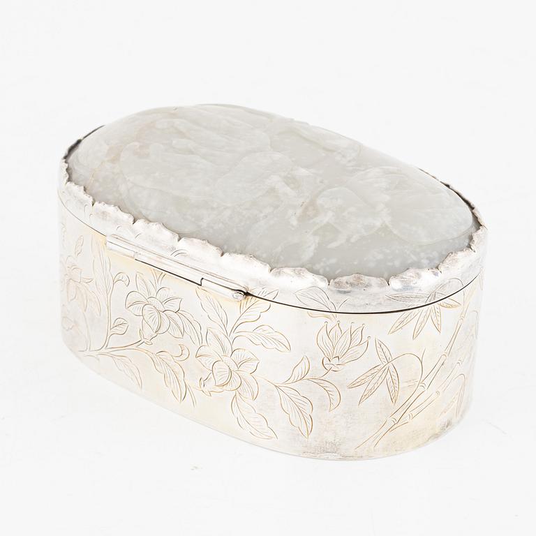 A silver box, the cover set with an inlaid Chinese nephrite relief, 20th century.