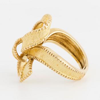 An 18K gold bow ring with French hallmarks.