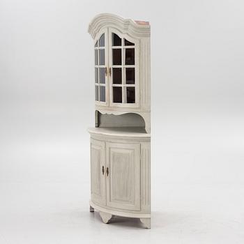 A Gustavian style 20th century corner cabinet.