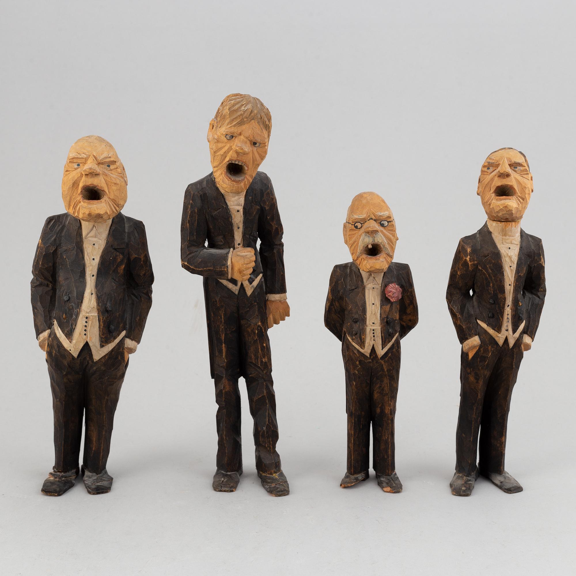 Four wooden sculptures by Axel Ericsson, signed and dated -29.