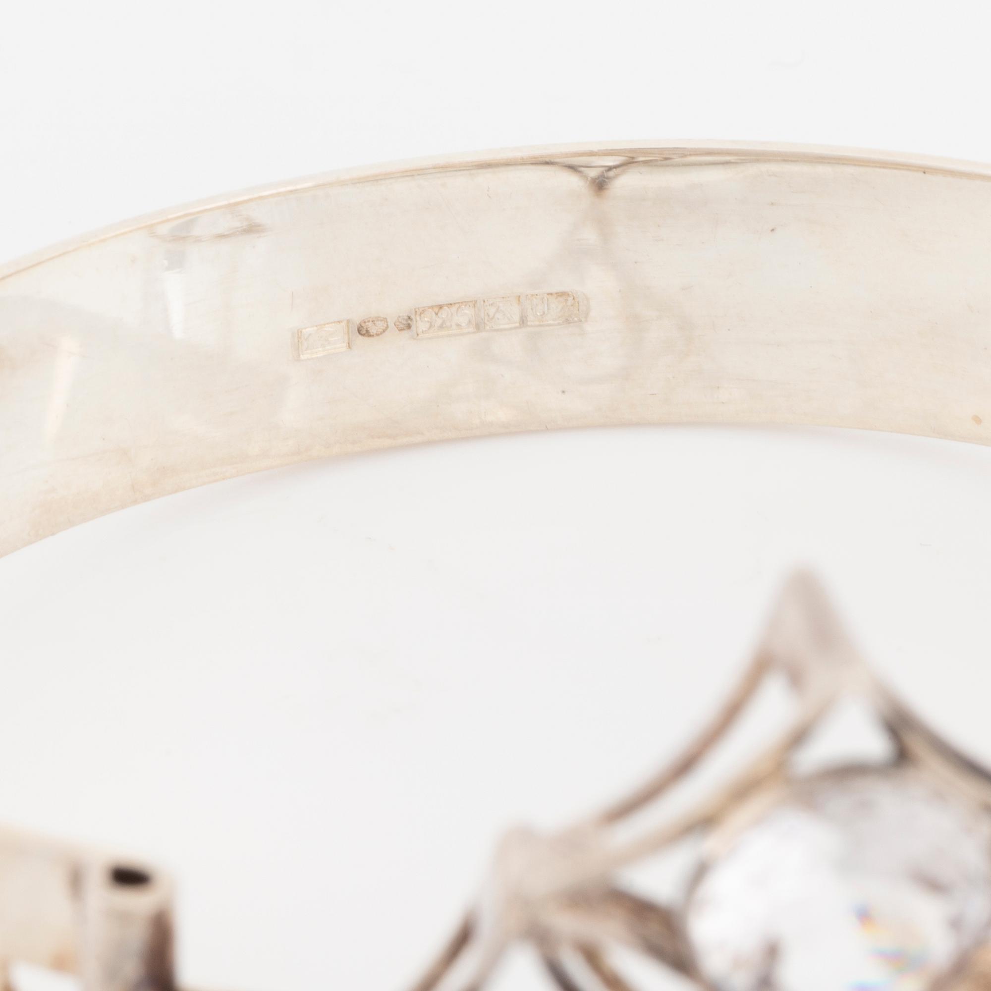Kultasepät Salovaara, sterling silver bangle and pendant with rock crystal and syntehtic white spinel.