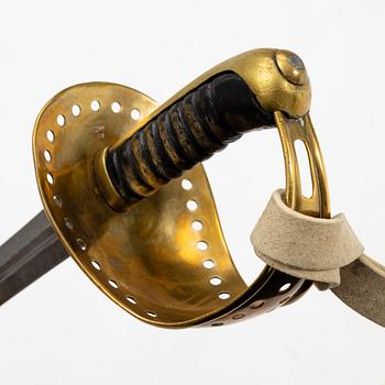 A Swedish 1893 pattern cavalry sabre, with scabbard.