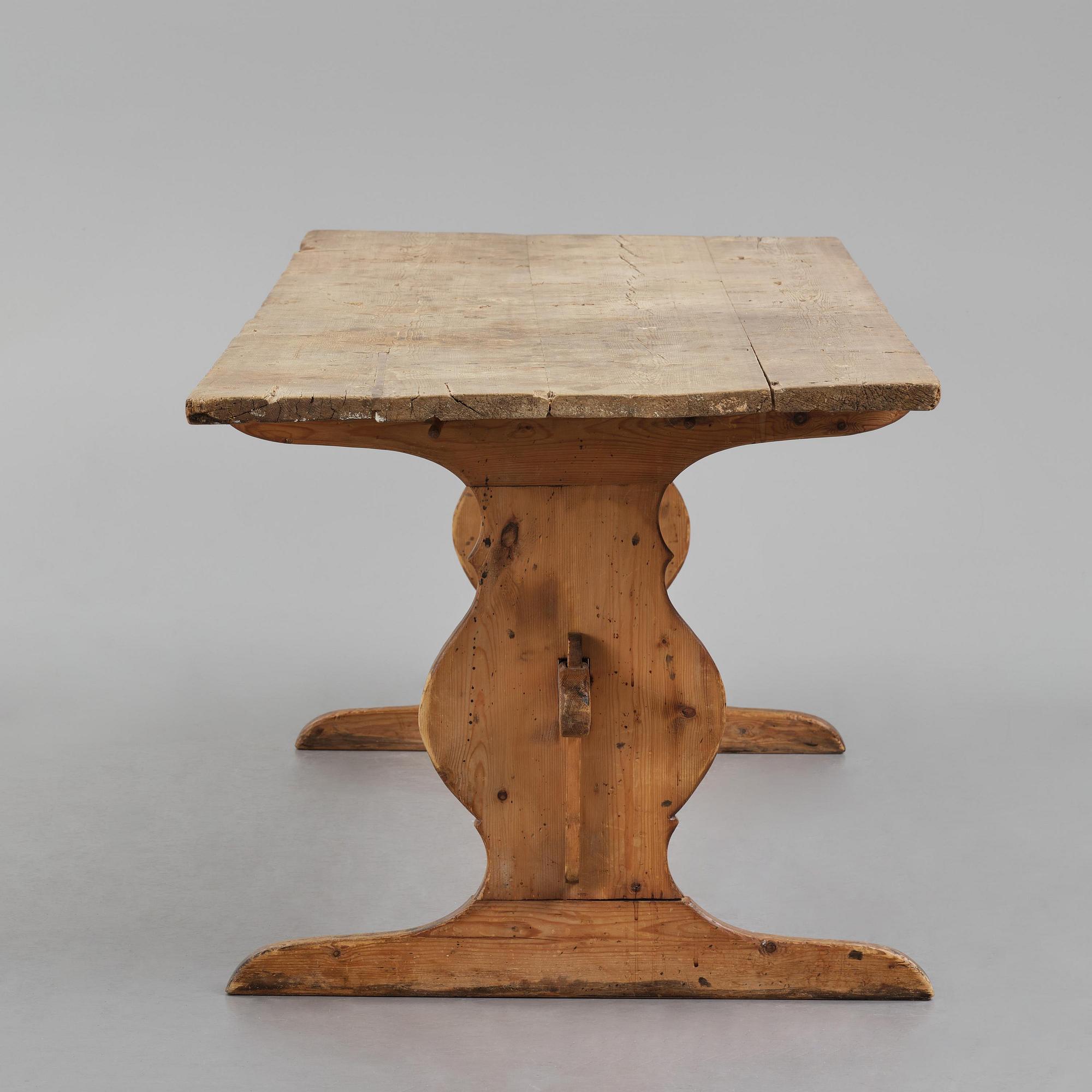 A pine trestle table, 20th century incorporating older elements.