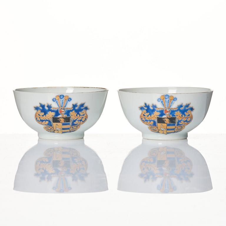 A pair of armorial cups with saucers, Qing dynasty, Qianlong (1736-95).