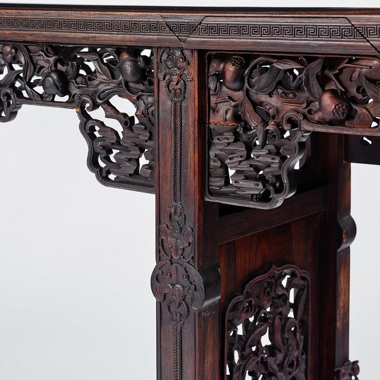 A massive zitan recessed-leg long table 'Jiaotousun Qiotouan', Qing dynasty, 19th century.