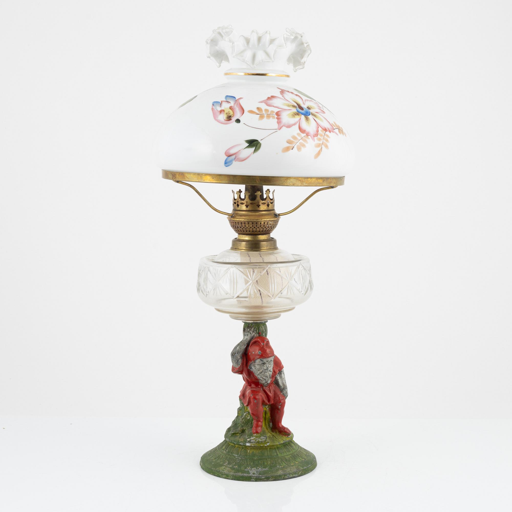 A early 20th century glass kerosene lamp.