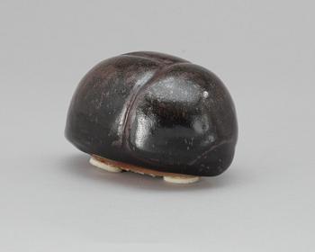 An Ulla Kraitz ceramic beetle.