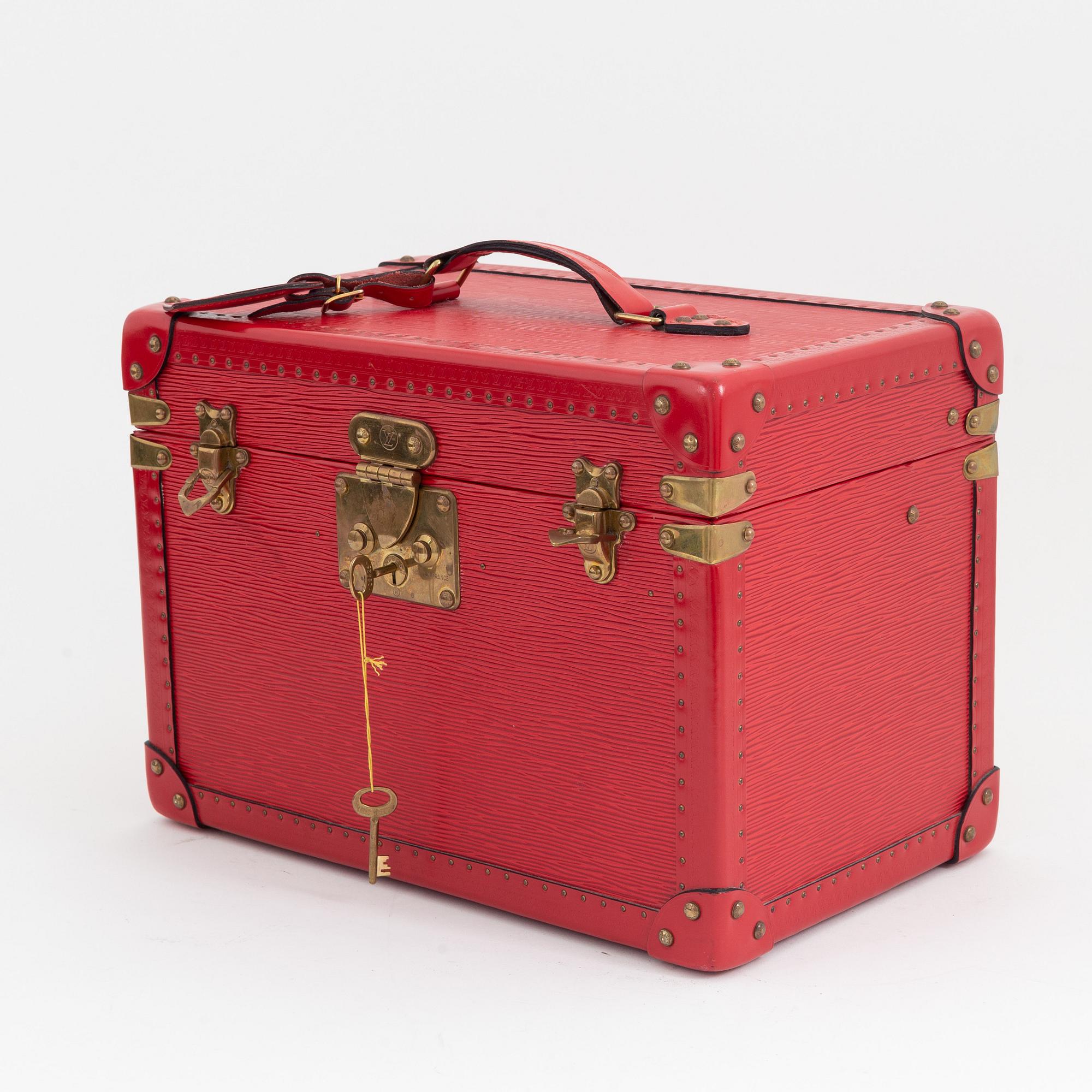 Louis Vuitton, a red Epi beauty box.