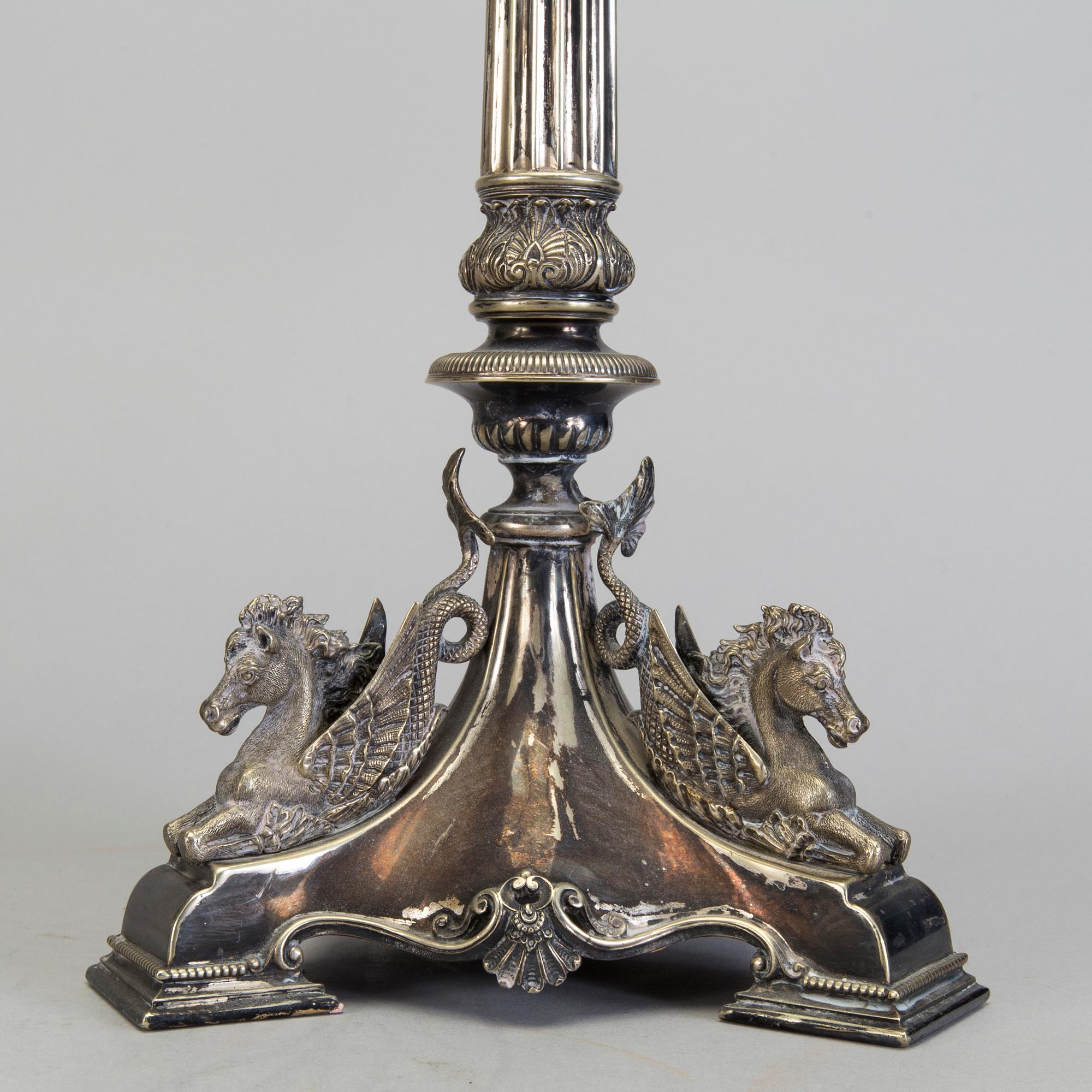 A pair of late 19th century silver plated kandelabras by Henry Wilkinson & Co Ltd, Sheffield, England.